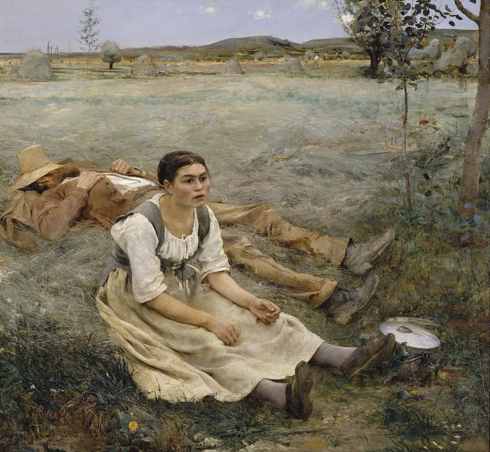 A young peasant woman sits dazed in a hayfield with her legs stretched out, staring ahead, while a man in a straw hat lies asleep on his back beside her, mown grass stretching to a village on the hill